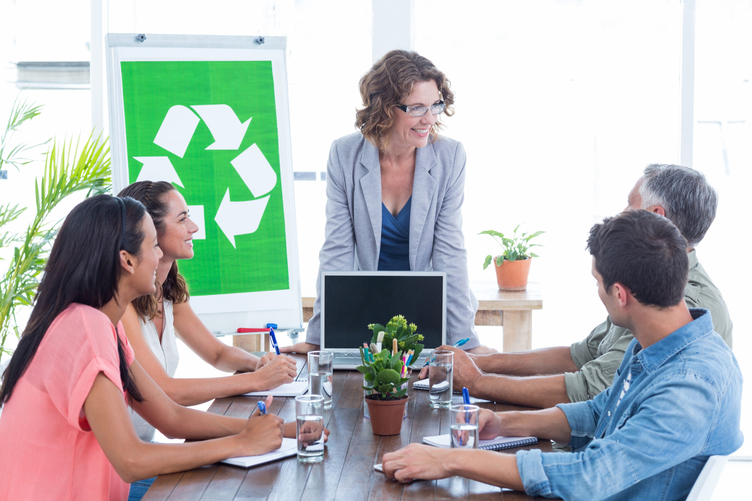 Young creative team having a meeting about recycling in creative office, E waste disposal.